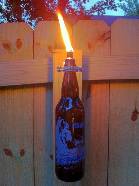 Beer Bottle Torch from Metal and Mud