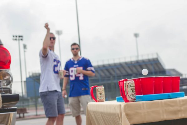 Bills fans play beer pong at a tailgate