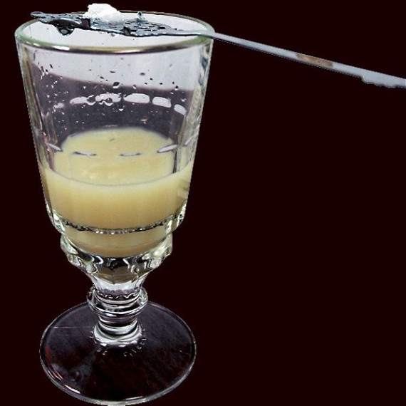 An absinthe spoon and specially designed glass are used to louche absinthe.