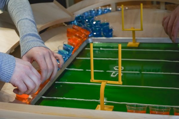 assembling a jello shot football snack stadium