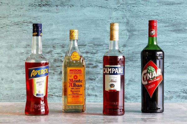 Aperol, Mezcal, Campari and Cynar Liquor Bottles