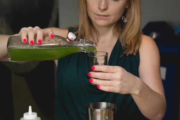 pouring a cocktail shrub