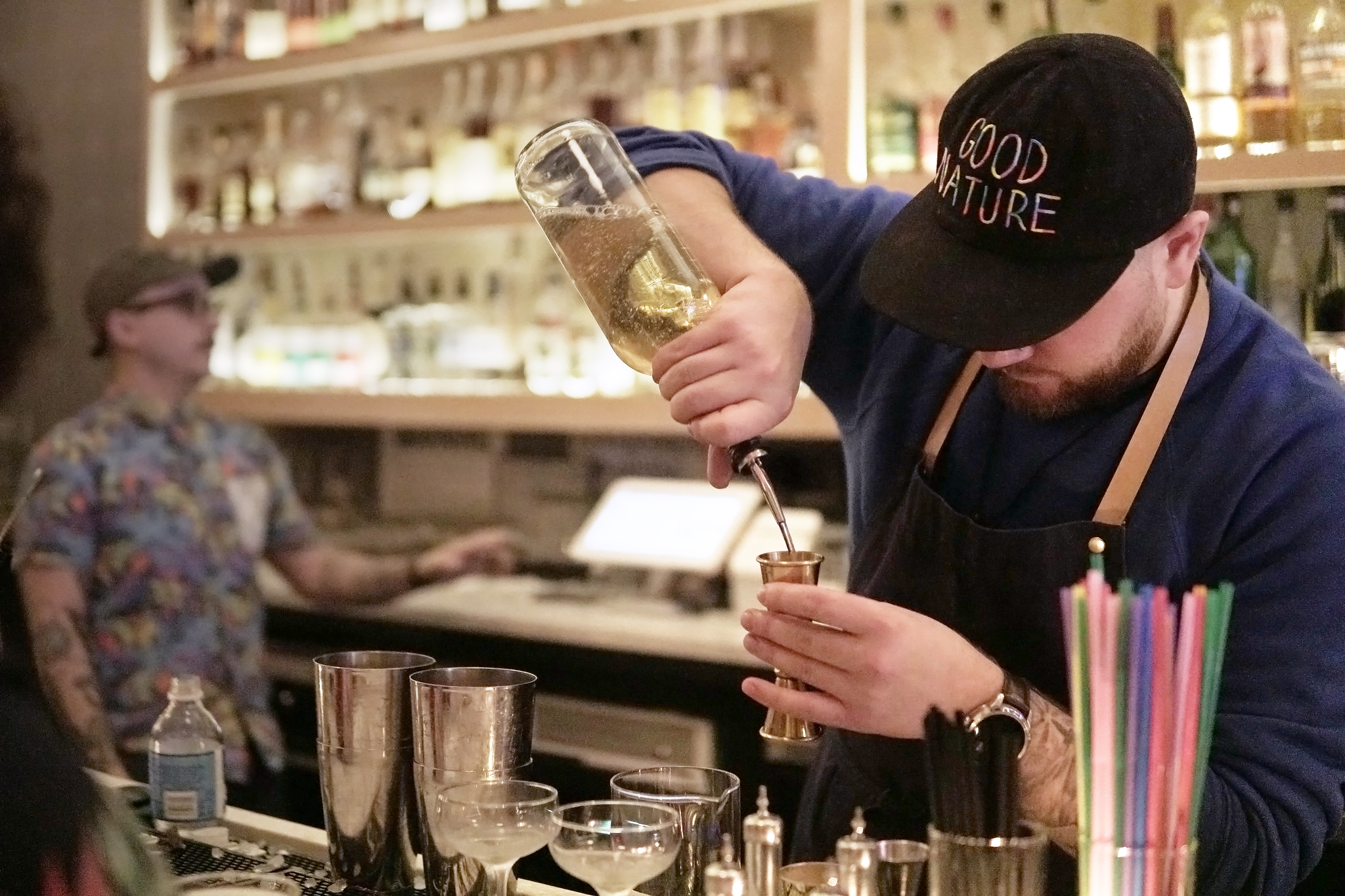 bartender filling a jigger