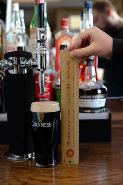 The standard busy bartender pour produced a beer head size of exactly 14/16”.