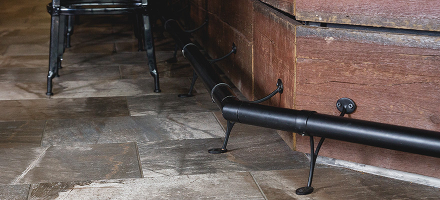 Example of a bar with a Matte Black bar rail installed